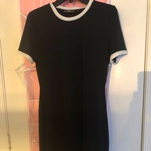 Long black medium sized dress (short sleeved)